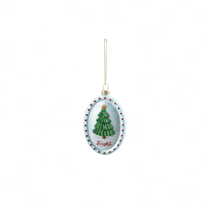 An oval Christmas ornament featuring a green tree with a gold star and the word 'Bright' in red script, hanging from a gold string against a white background.