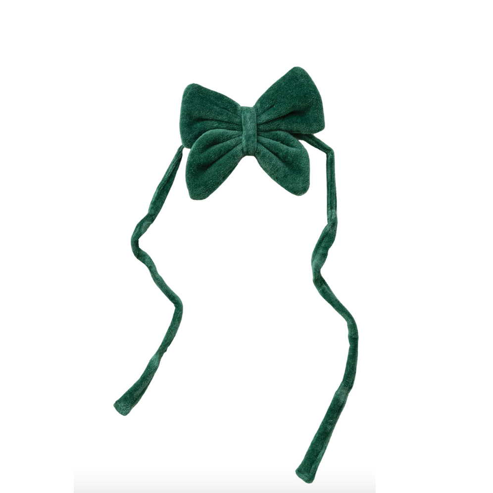 A dark green velvet bow with long, thin ties, shown against a plain white background.