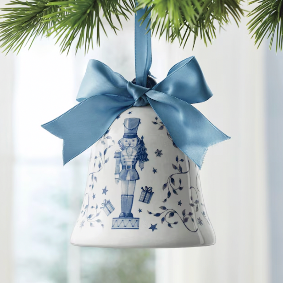 White & Blue Ceramic Bell Ornament with Nutcracker