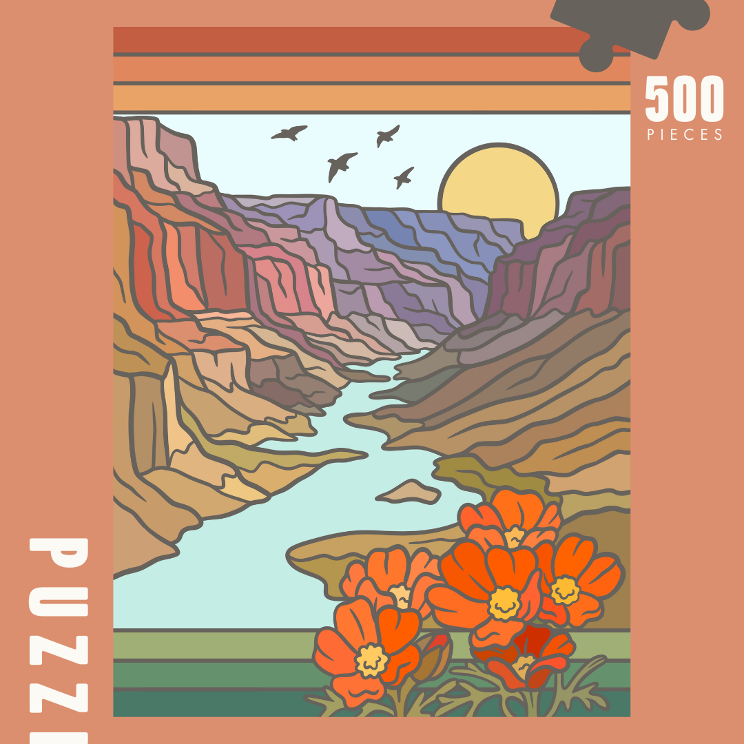 Image of puzzle box, showing full puzzle design. Layered red rock walls fading into deep muted blues and purple, sunset in back ground, water running through middle. Poppies in the forefront right side corner.