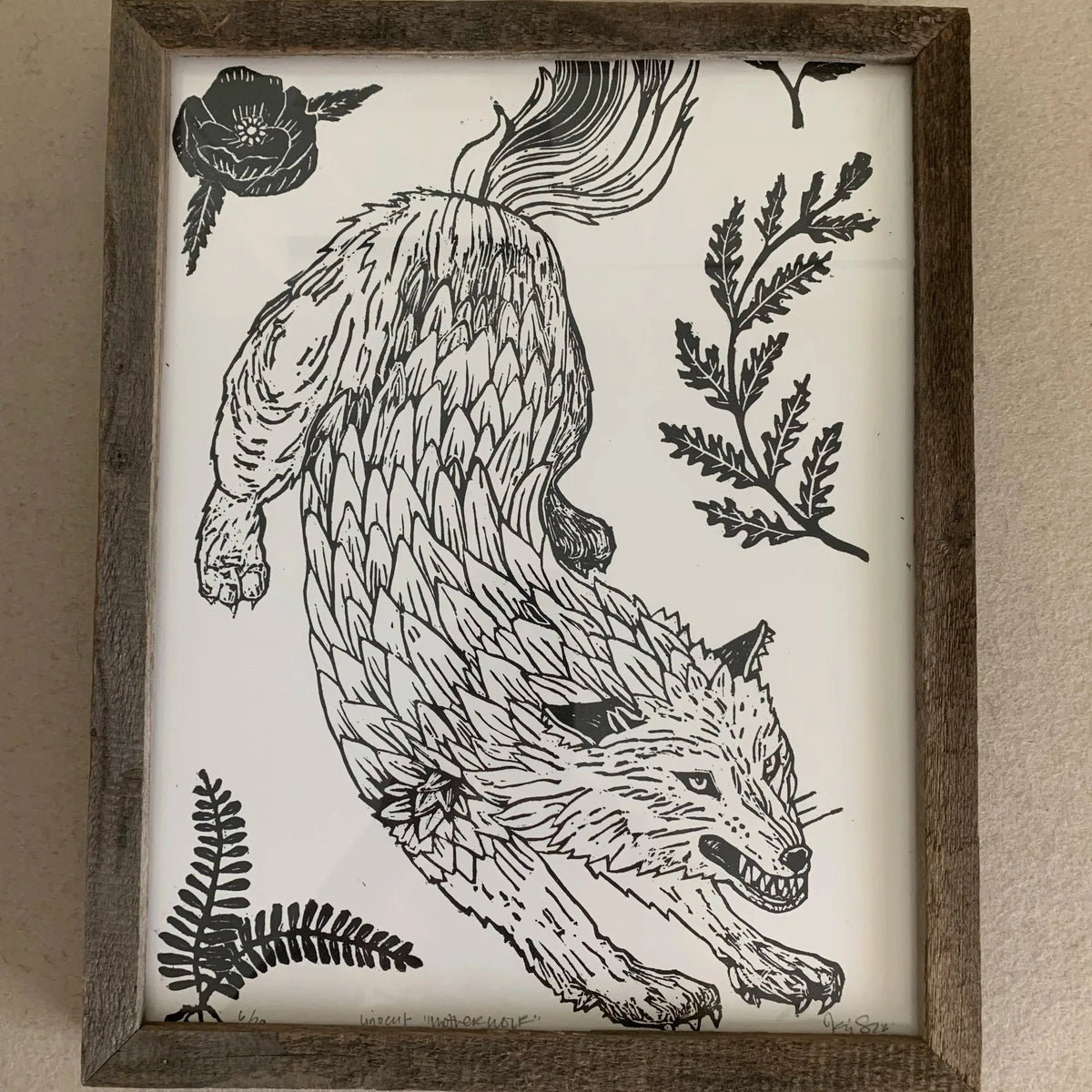 Framed wolf print.