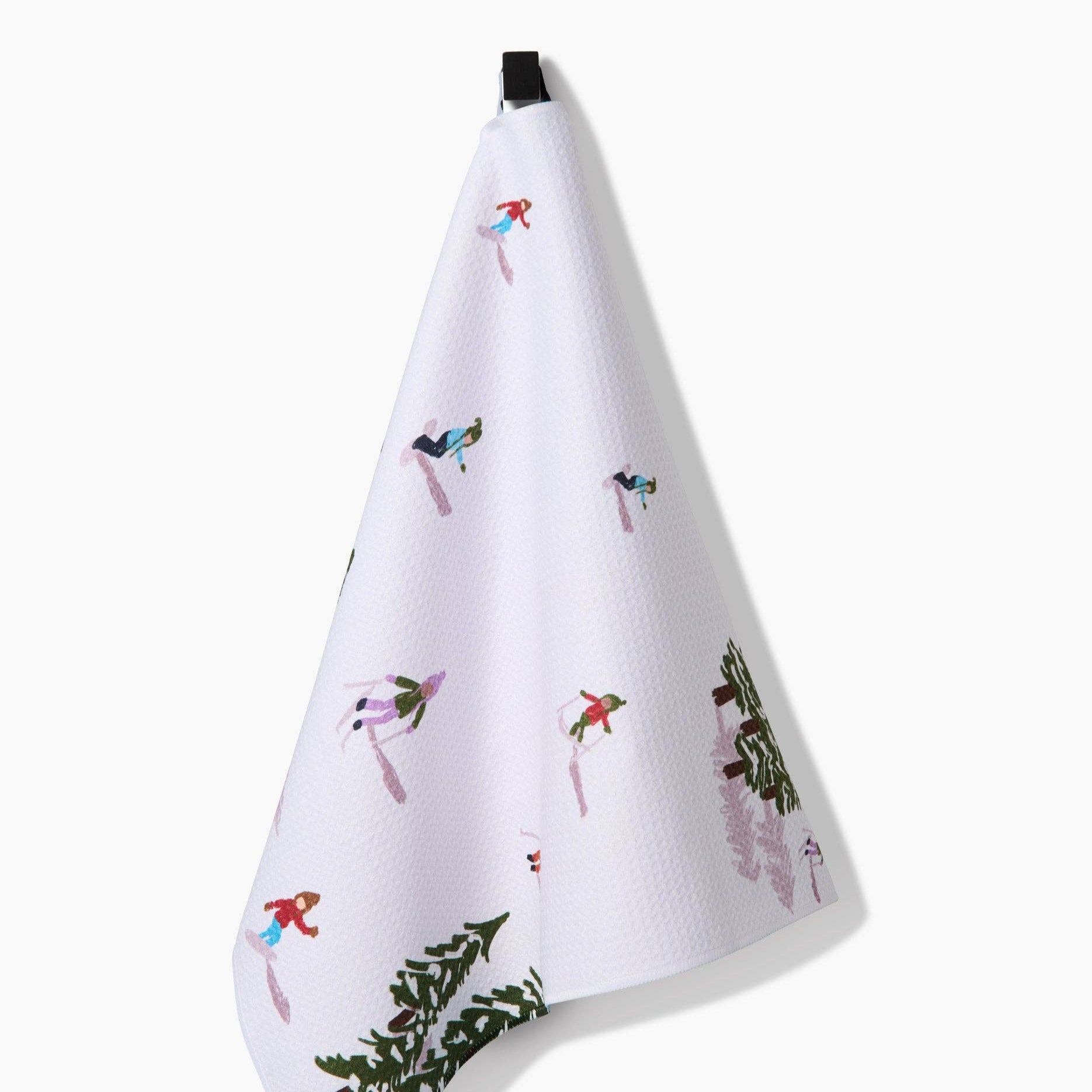 White towel with winter-themed designs on a white background
