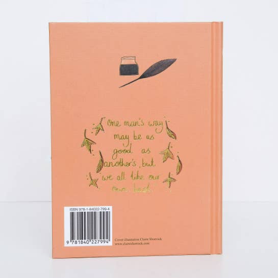 Peach-colored book with text and feather illustration on a white background
