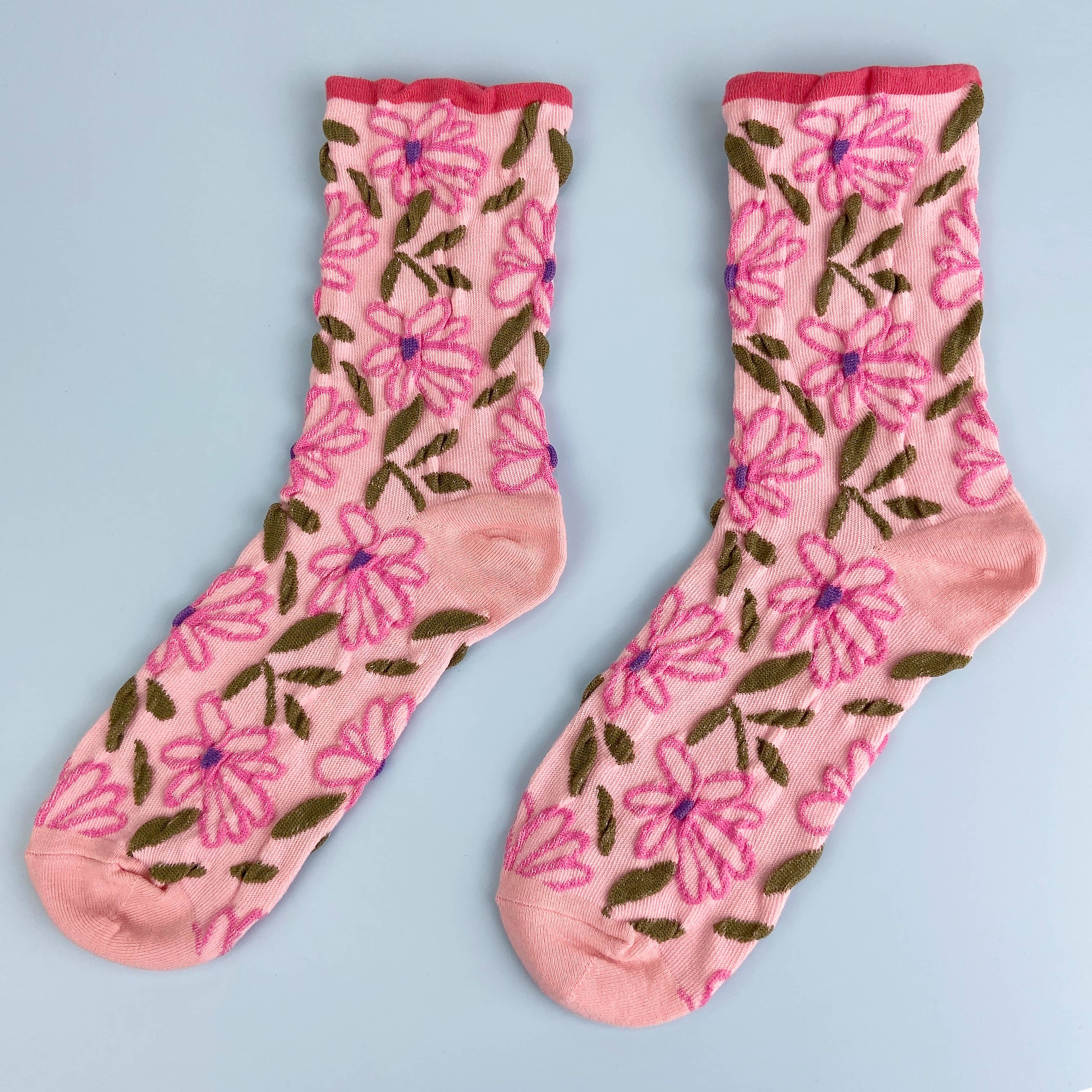 Step into comfort with these charming Sweet Flower Tube Socks in a pretty pink hue. Featuring an adorable floral pattern, these socks bring a touch of botanical beauty to your everyday wardrobe. Perfect for adding personality to your shoe collection, they're designed to keep your feet cozy and supported throughout the day. Whether you're lounging at home or out and about, these delightful tube socks are a wonderful way to express your love for nature-inspired style.