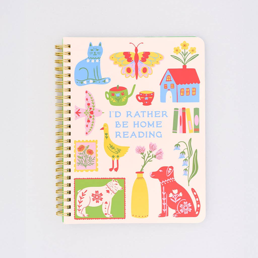 Notebook with colorful illustrations and text on a white background that says " i'd rather be reading"