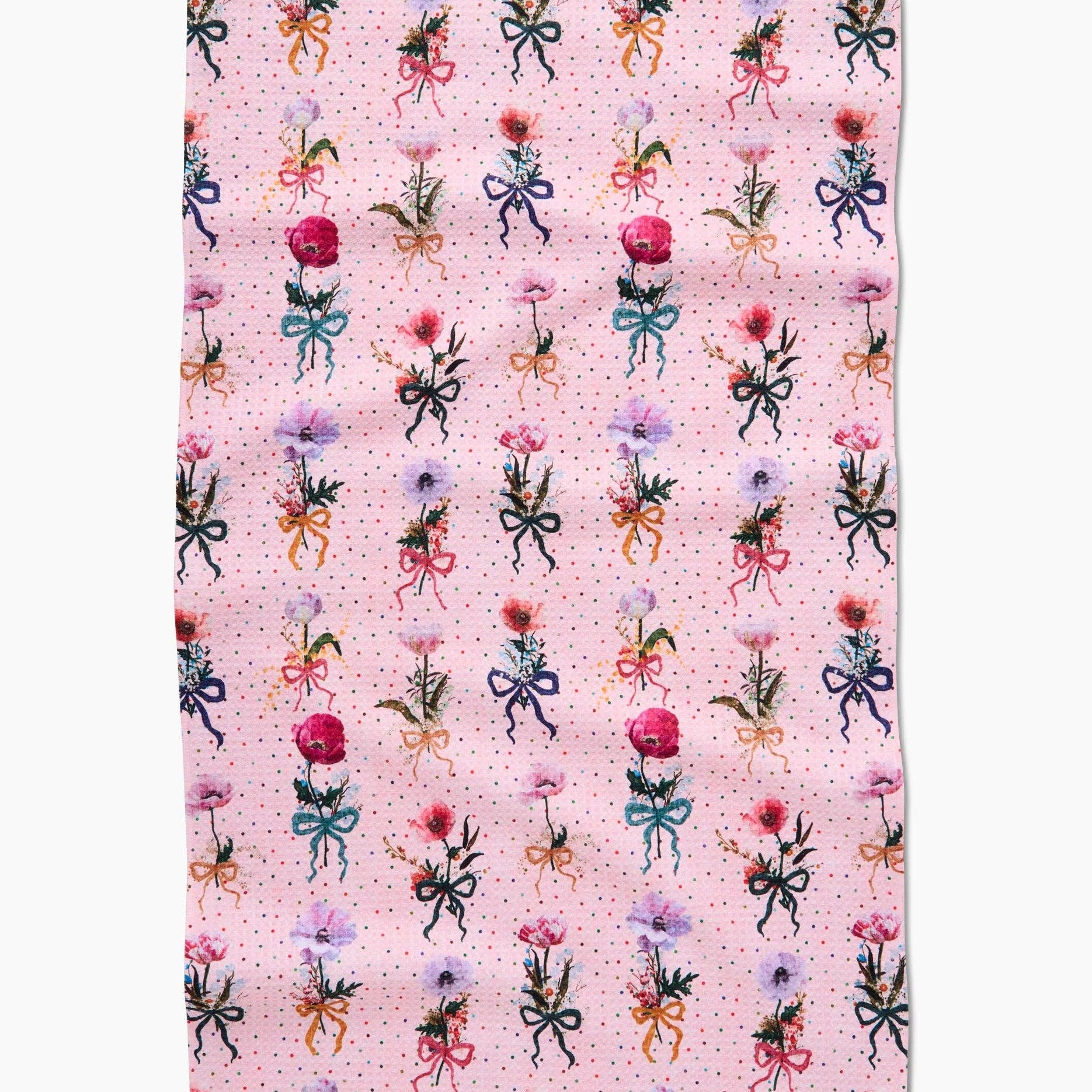 Floral and bow patterned fabric on a pink background Tea Towel