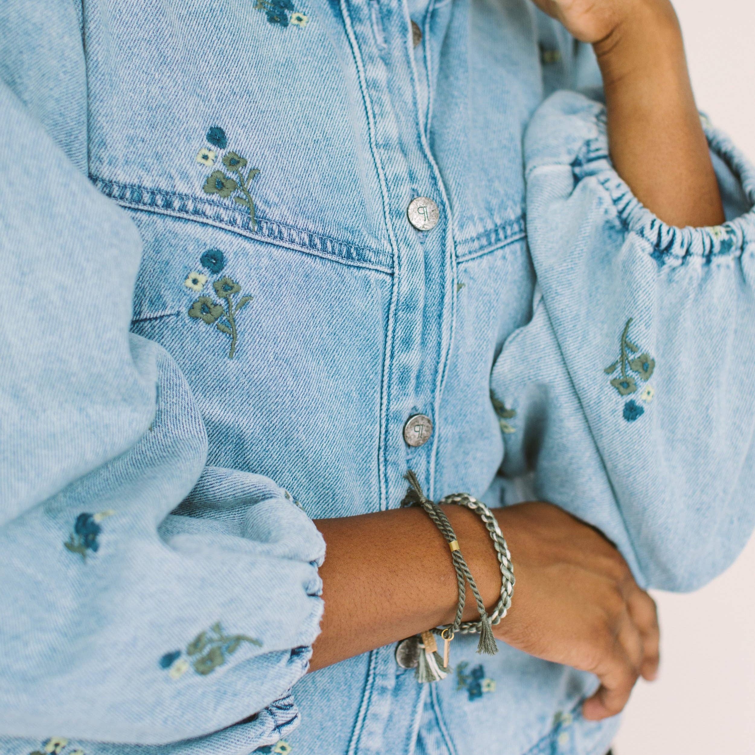 A delicate twist on Twenty Two West's crowd-favorite rope bracelets. The rope is hand spun from a single hue of cotton threads to create this soft and comfortable adjustable bracelet. Wear them individually or collect them all to mix-and-match in a complementary stack! Eucalyptus color.