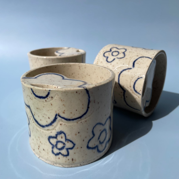 3 gray speckled travel sipper cups with blue flowers