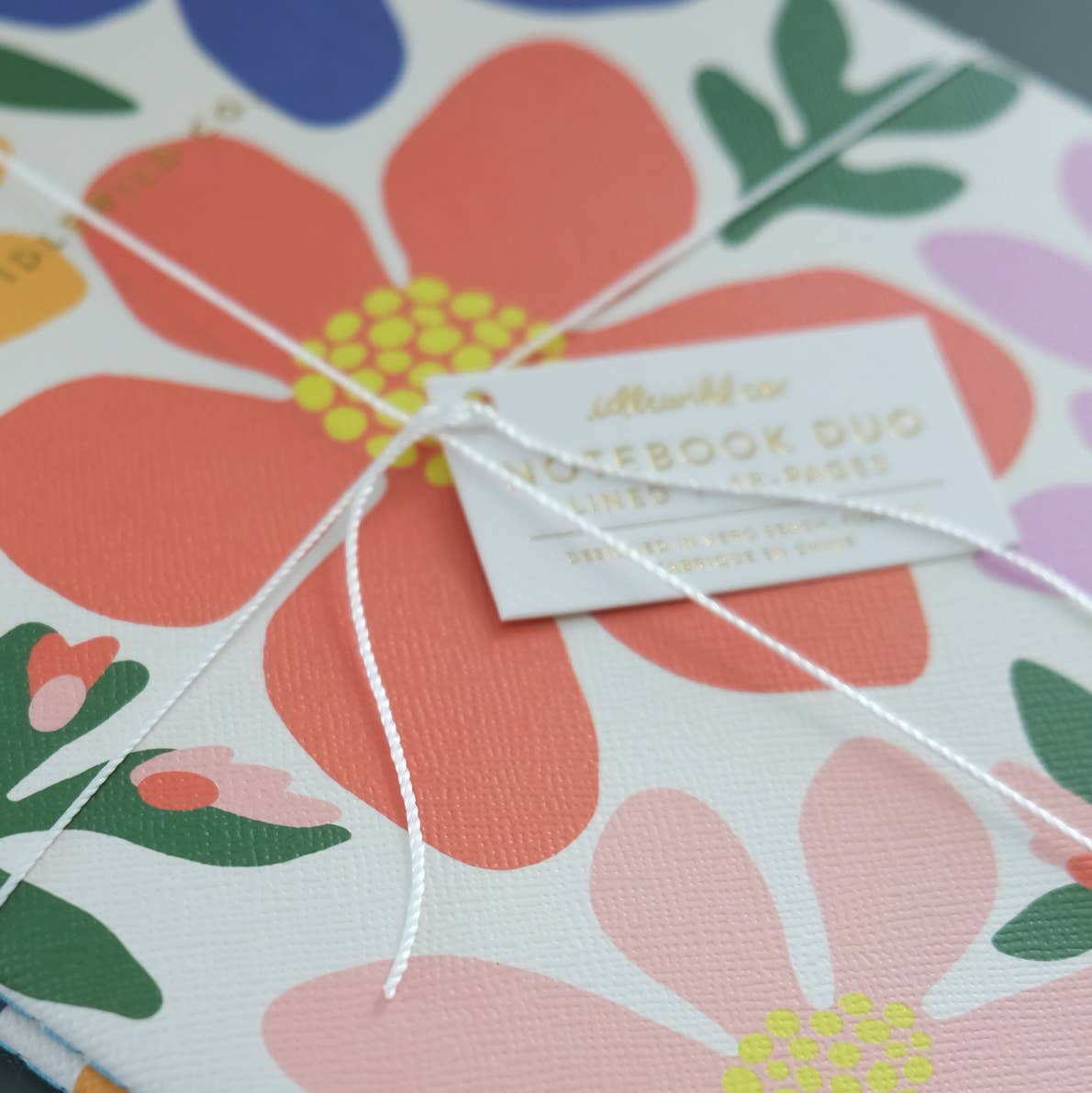 Floral-patterned product with a tag on a white background