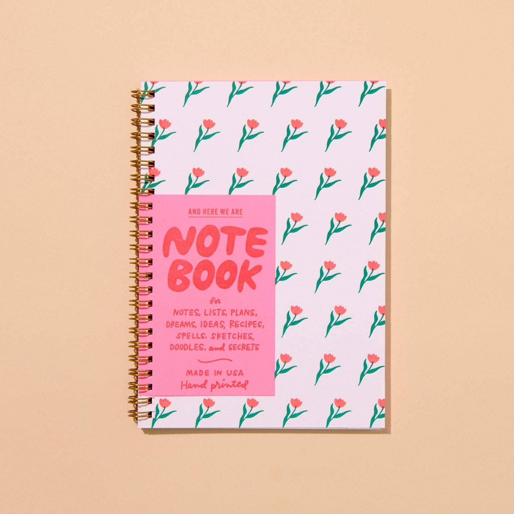 Perfect for Spring and Mother's Day gifting! A fun modern floral tulip pattern, hand printed in vibrant neon inks, makes this letterpress A5 spiral-bound notebook a perfect mother's day or back to school gift.
And Here We Are® creates modern, colorful, hand-printed greeting cards, notebooks, stationery, and gifts from our letterpress studio in Columbus, Ohio. Our best-selling
Details:
48 lined pages, 30% post-consumer recycled
hand printed/assembled in the US
Spiral bound notebook with gold colored coil