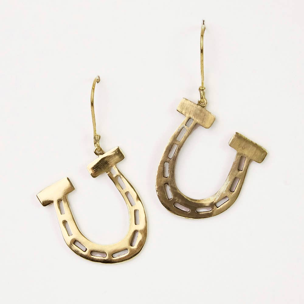 Gold horseshoe-shaped earrings on a white background