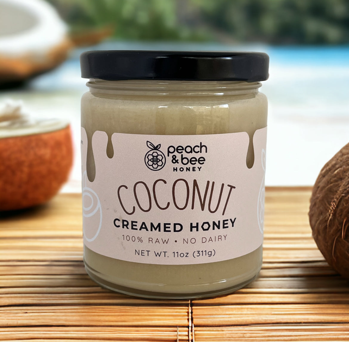 A jar of Peach & Bee creamed honey with coconut flavor