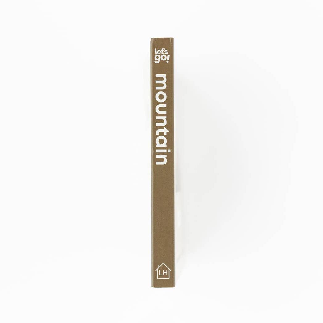 Tall, thin product packaging with 'lets go mountain' text on a white background