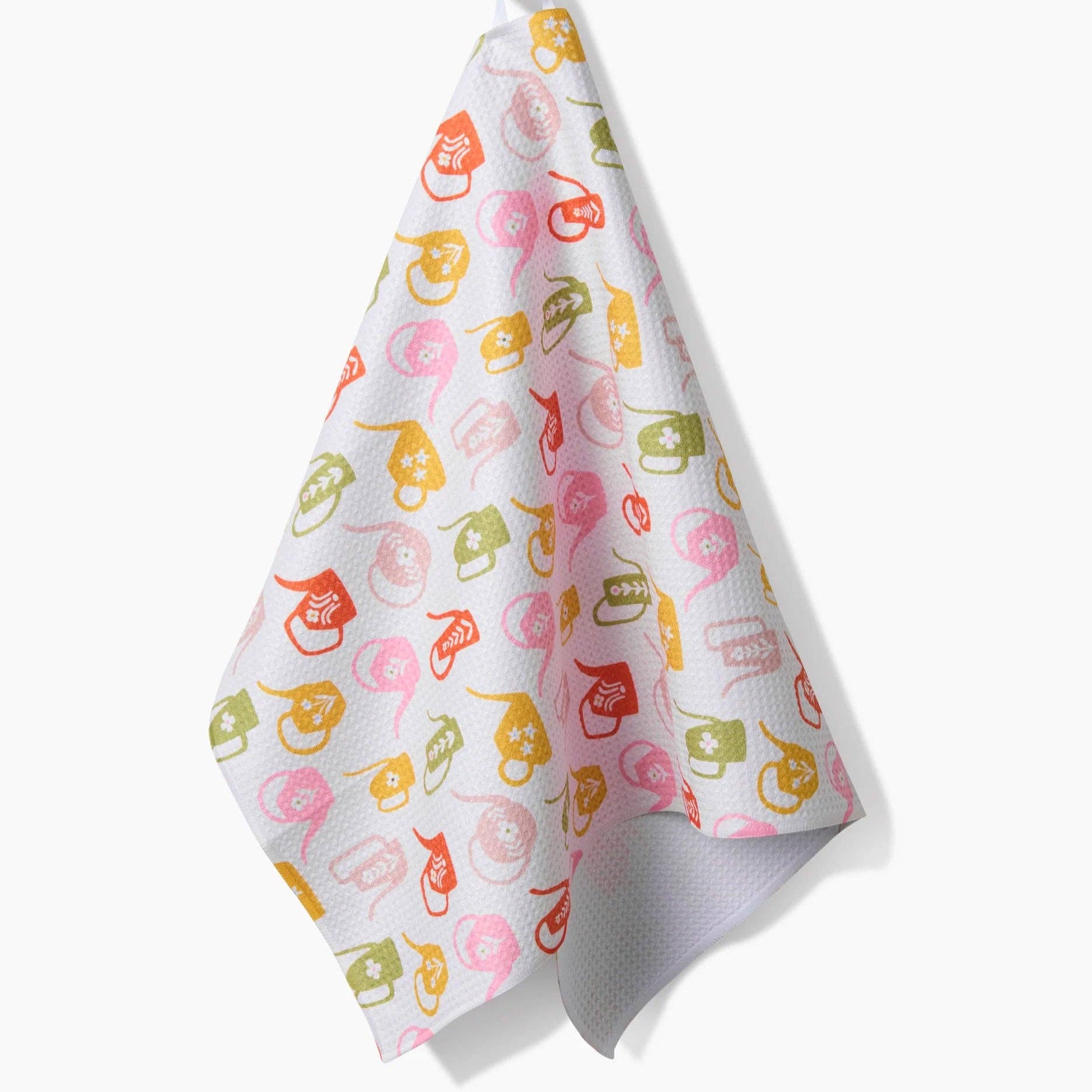 Colorful watering cans pattern towel on a white background