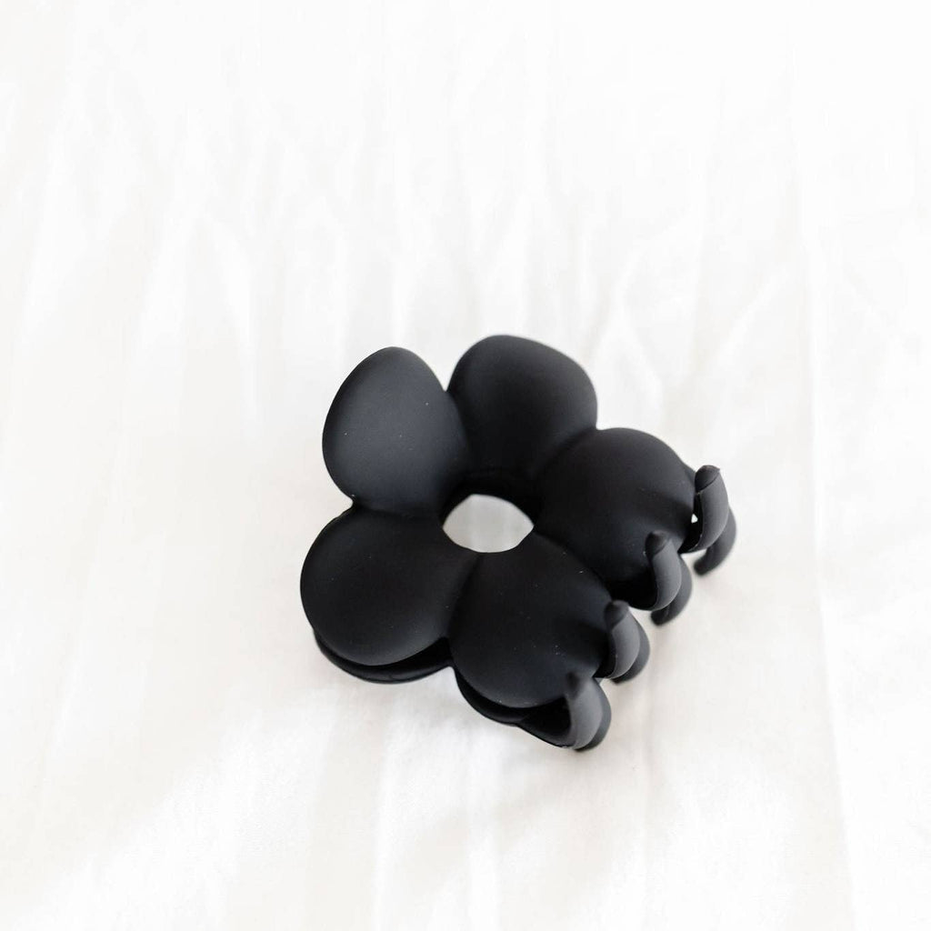This flower claw clip is perfect for all hair types, but especially thick hair! It's super deep and has curved claws that keep your hair secure and up all day. It adds the cutest dainty touch to any hairstyle or outfit, and it's definitely a must. It is a medium size claw clip that measures about 2.5 inches.