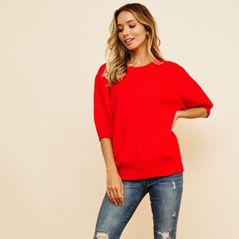 Get cozy, cute, and a little bit quirky with this Puff Sleeve Cropped Sweater. The unique puff sleeves add a fun twist to this classic cropped style, making it a must-have for your wardrobe. Perfect for layering or wearing solo, this sweater is bound to become your new go-to piece.