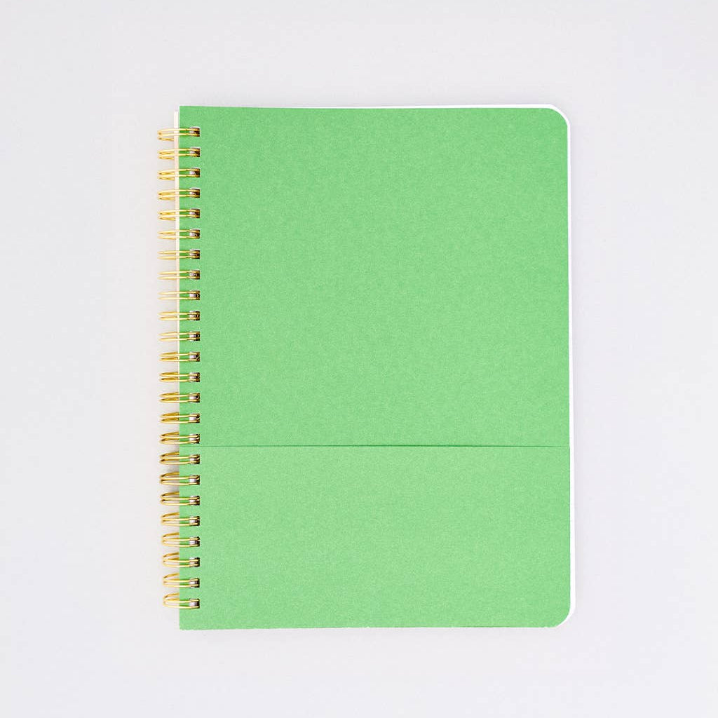Green colored spiral-bound notebook on a white background
