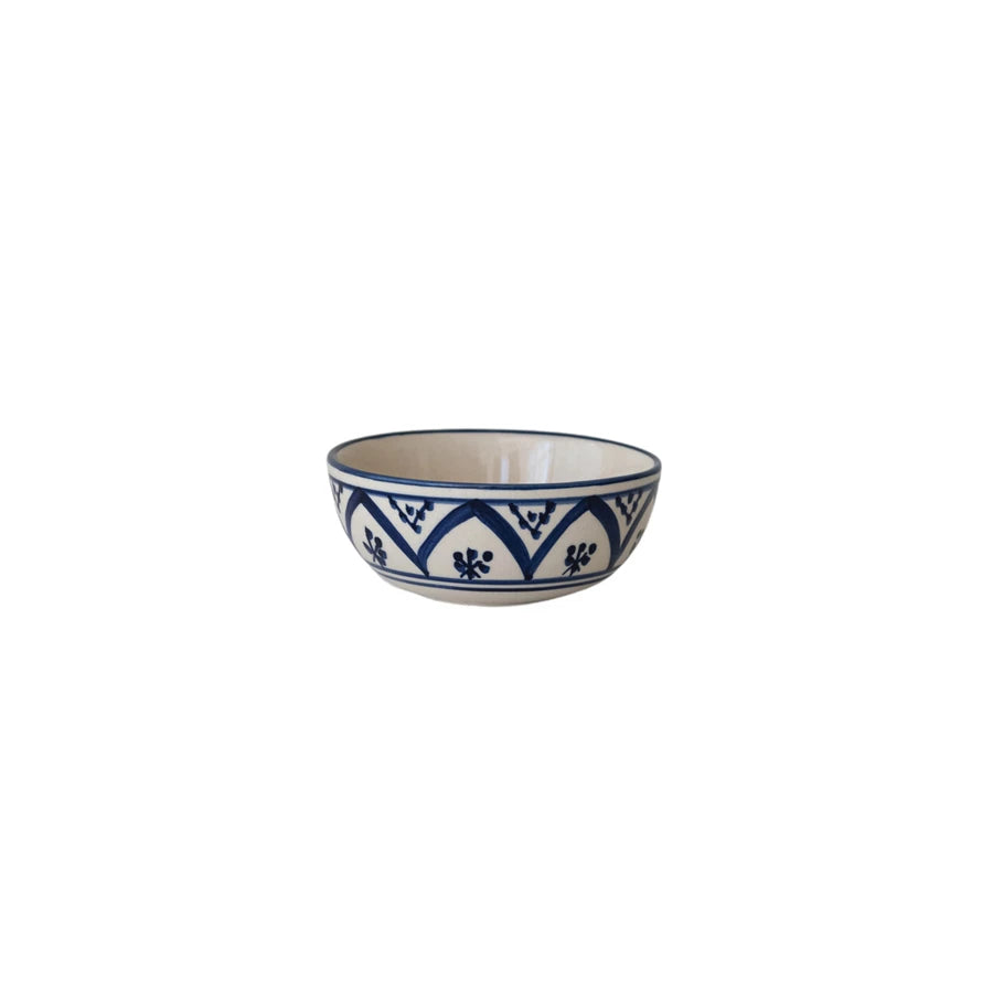Serve up smiles with this Hand-Painted Stoneware Bowl in creamy tones and cheerful blue patterns! Perfect for everything from morning cereal to midnight snacks, its playful design adds a pop of color and charm to your table. Each bowl is uniquely crafted, making every meal feel a little more special and a lot more fun! 4" Round x 1-1/2"H