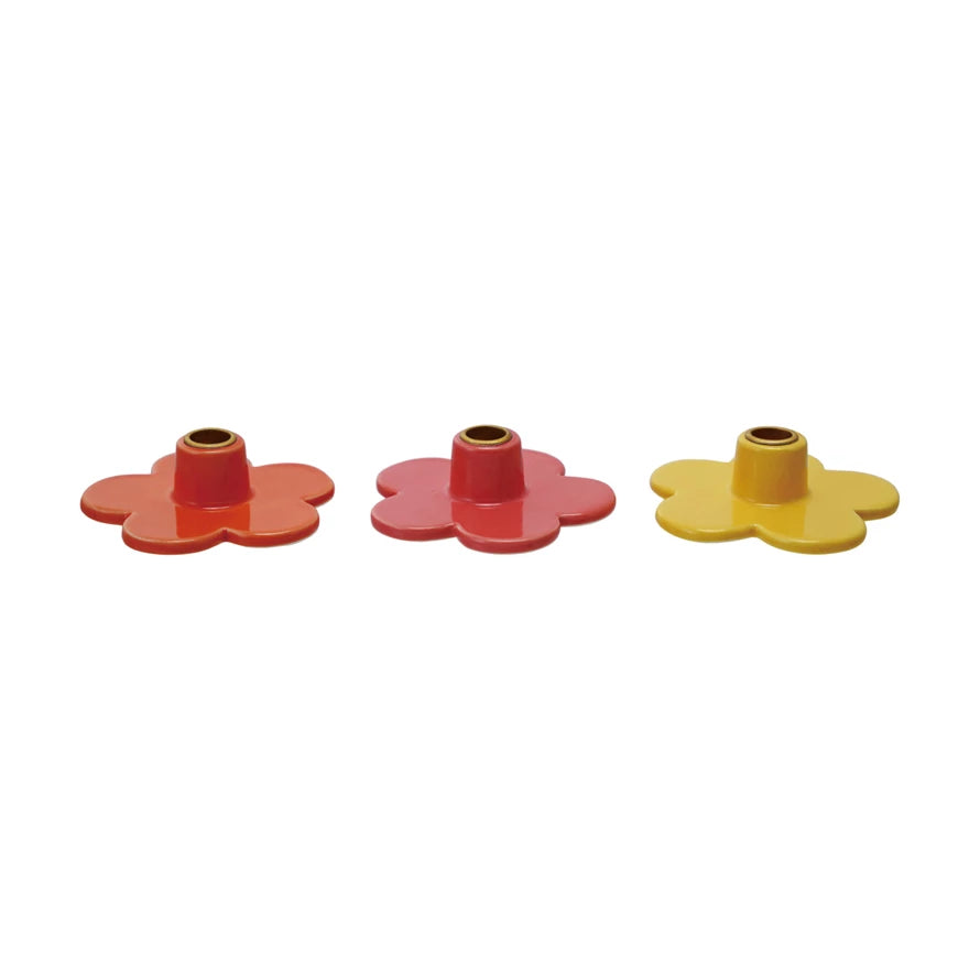 Add a touch of whimsy to your decor with our Stoneware Flower Shaped Taper Holder, available in 3 colors. This holder not only holds your taper candles securely, but also doubles as a charming tabletop accent. Brighten up any room with this playful and unique piece! 3"L x 3"W
