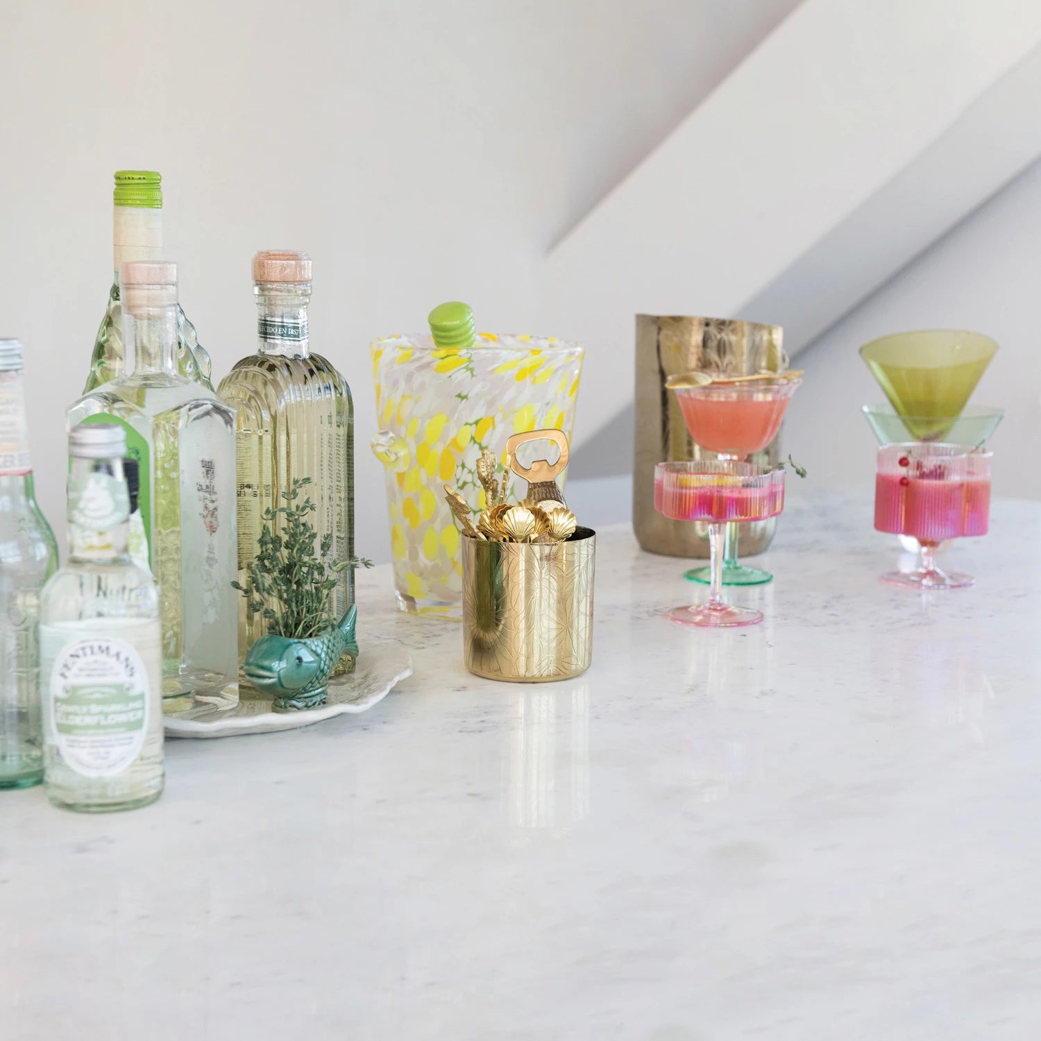 Sip in style with our Hand-Blown Pleated Flower Shaped Stemmed Coupe Glass. Its unique design adds a touch of whimsy to any cocktail, while the hand-blown craftsmanship ensures a high-quality and one-of-a-kind drinking experience. Cheers to sophisticated playfulness! 4" Round x 4-1/2"H. 6 oz.