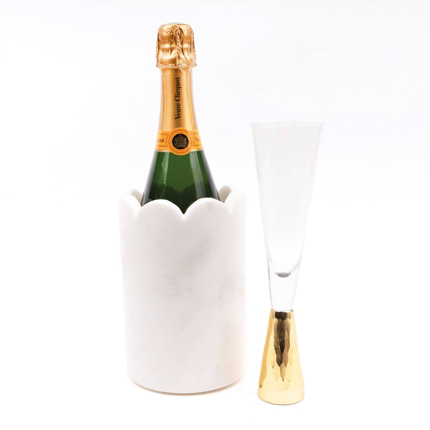 Serve your favorite beverages in style with our White Scalloped Marble Chiller, a handcrafted piece that combines elegance, functionality, and timeless design. Made from luxurious white marble, this chiller features delicate scalloped edges, adding a sophisticated touch to your table or bar setup. Perfectly sized to fit a standard 750ml wine, champagne, or sparkling water bottle, it keeps drinks chilled while providing a striking presentation for entertaining.