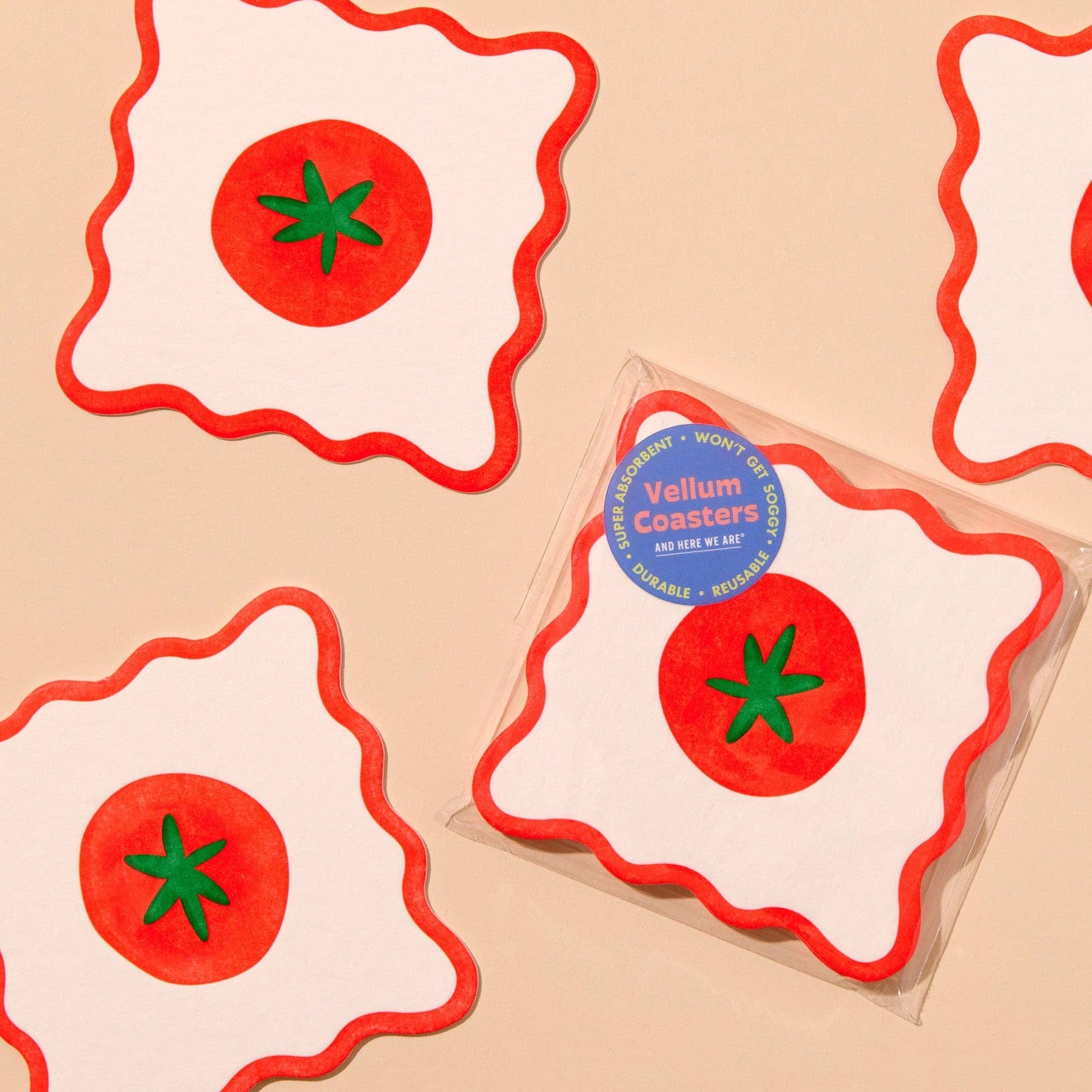 Vellum coasters with tomato design on a beige background