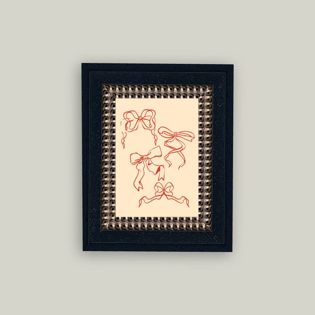 Celebrate love with this charming Valentine Bows framed artwork, featuring delicate bows rendered in a vintage aesthetic. The ornate frame adds timeless elegance to any space, making it perfect for displaying during the season of romance or year-round. At 5x7 inches, this piece brings warmth and nostalgia to your home décor. Whether you're gifting it to someone special or treating yourself, this artwork captures the sweetness of Valentine's Day in a way that feels both classic and heartfelt.