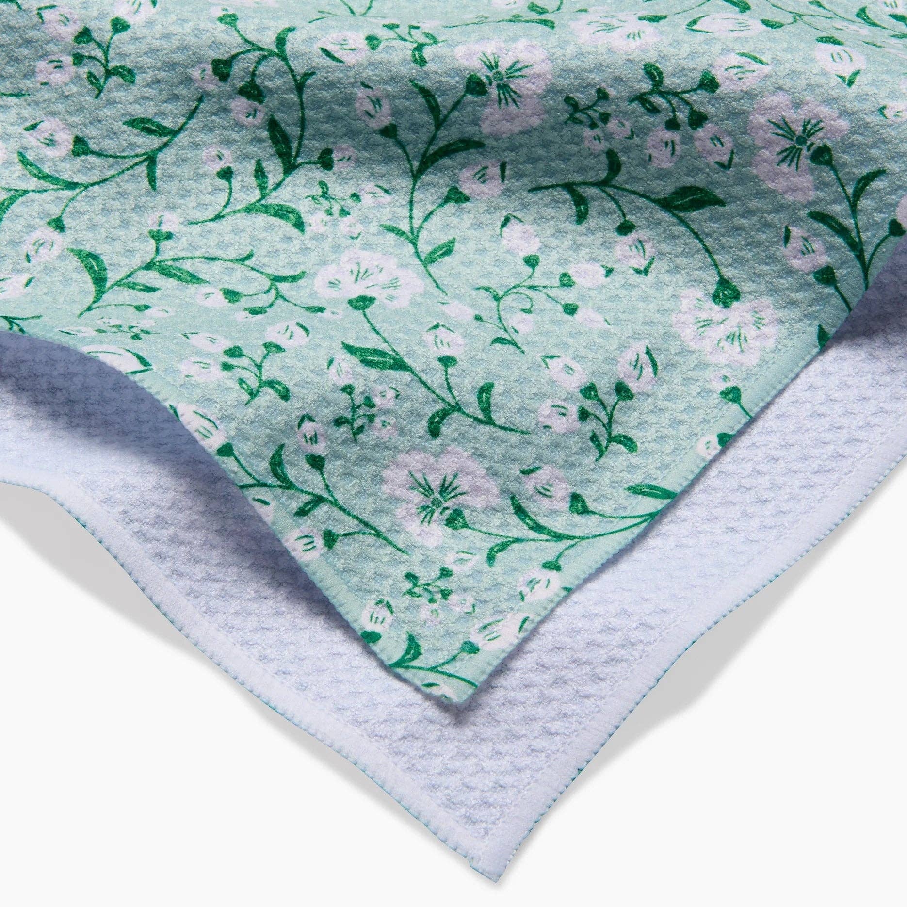 Floral patterned fabric with a textured border on a white background Tea Towel