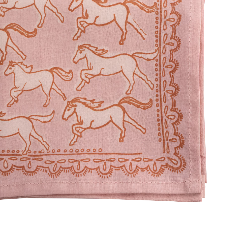 Pink fabric with horse patterns and decorative border