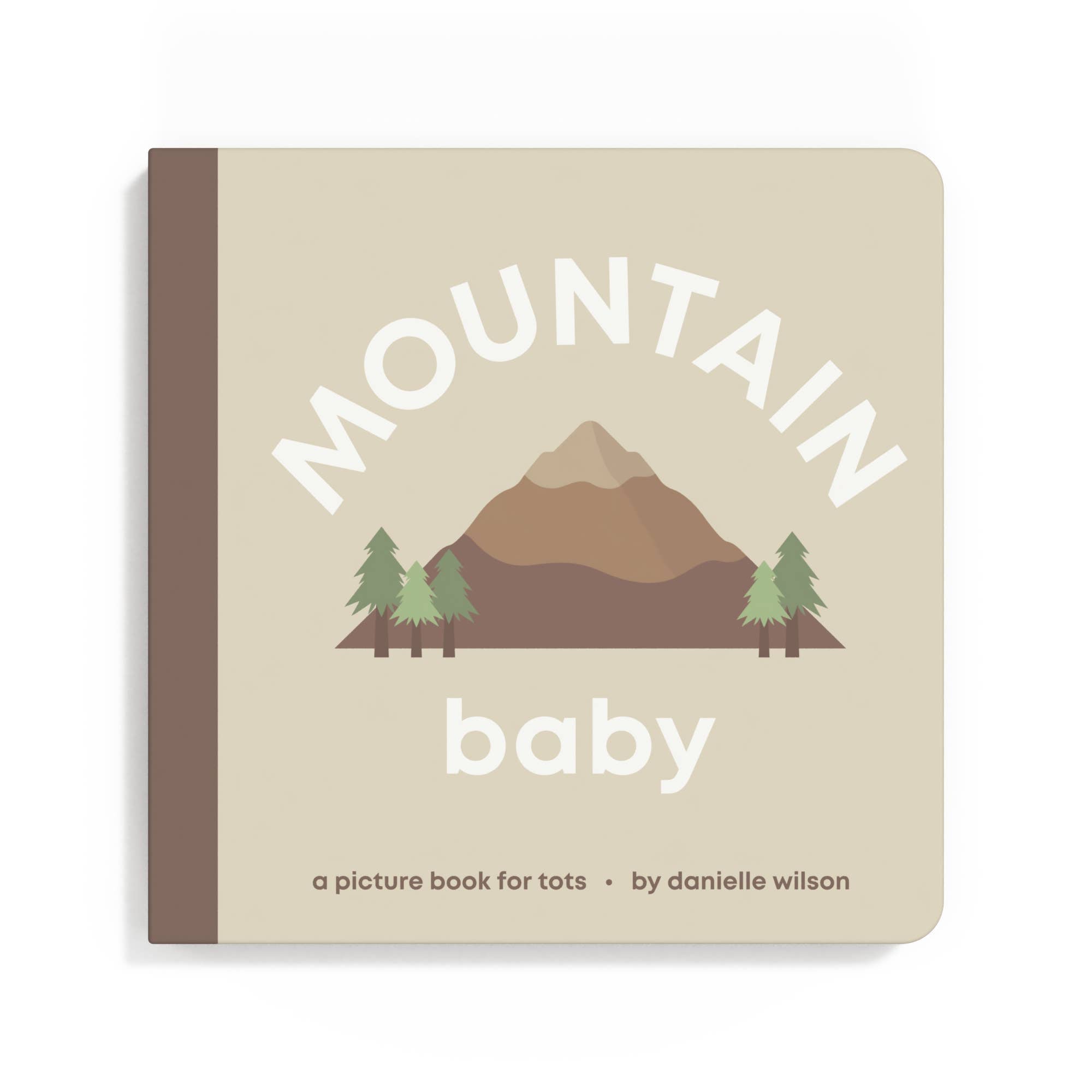 Book titled 'Mountain Baby' with a mountain and trees illustration on a beige background