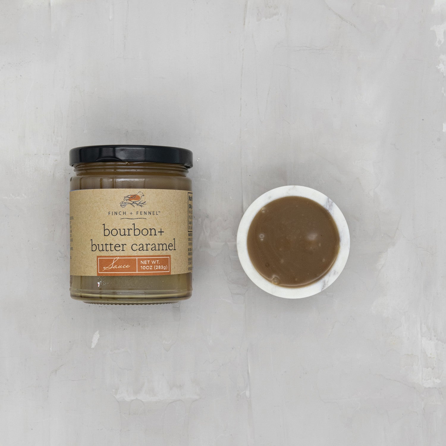 Indulge in the decadent flavor of our 10 oz. Bourbon + Butter Caramel Sauce. This luxurious sauce features a rich, buttery caramel base infused with a hint of warm, smooth bourbon. It's the perfect topping for ice cream, pancakes, waffles, or simply enjoyed by the spoonful. Elevate any dessert with this sophisticated and comforting treat.