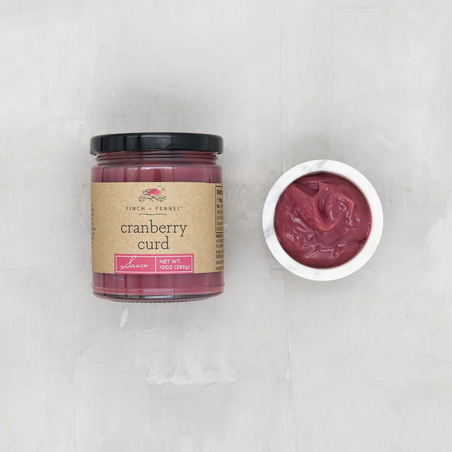 Our 10 oz. Cranberry Curd Sauce is a delightful blend of tart cranberries, rich butter, and sweet sugar, creating a velvety smooth and bright curd. Perfect as a topping for scones, toast, or pancakes, or as a vibrant filling for tarts and cakes. This sauce adds a sophisticated, fruity twist to any dessert.