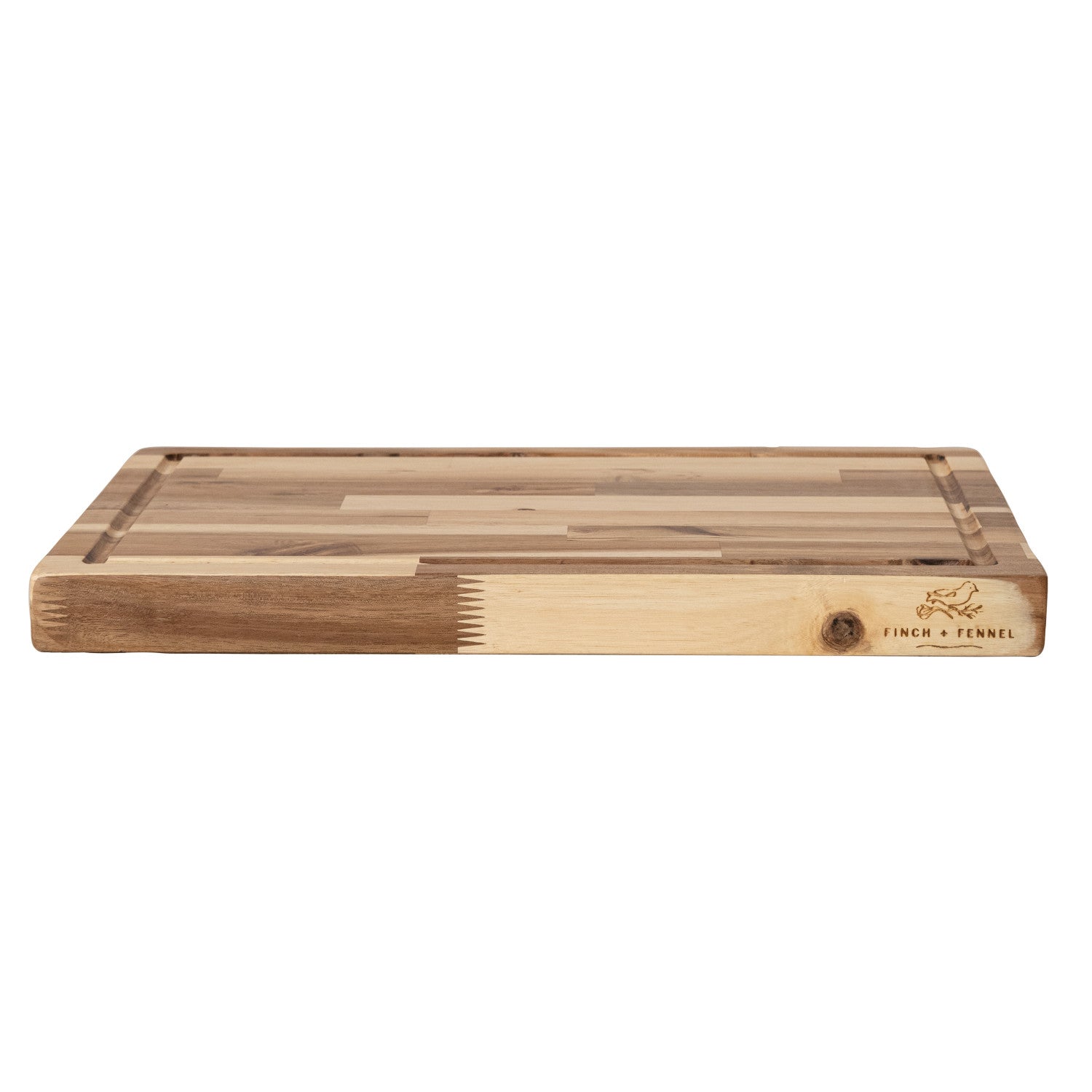 Elevate your entertaining with the Acacia Wood End Grain Cheese/Serving Board. Crafted from beautiful acacia wood with a durable end-grain surface, this board is perfect for serving cheeses, charcuterie, appetizers, and more. It features convenient handles and is laser-etched with the "Finch + Fennel" logo, combining rustic charm with sophisticated detail. A stylish and practical addition to any kitchen or dining experience.