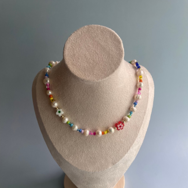 pearl necklace with rainbow beads and an assortment of glass flower beads