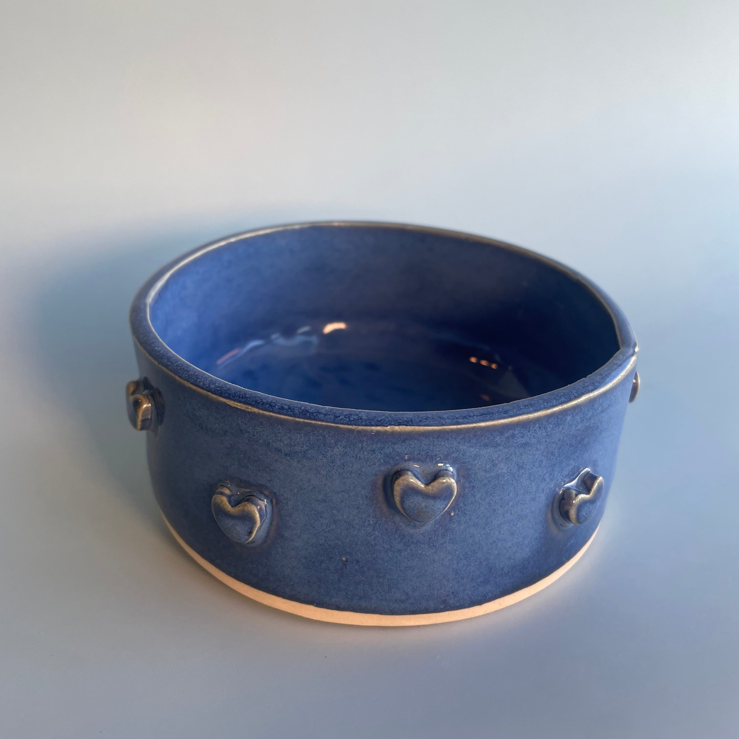 12 oz blue ceramic bowl with hearts on the sides