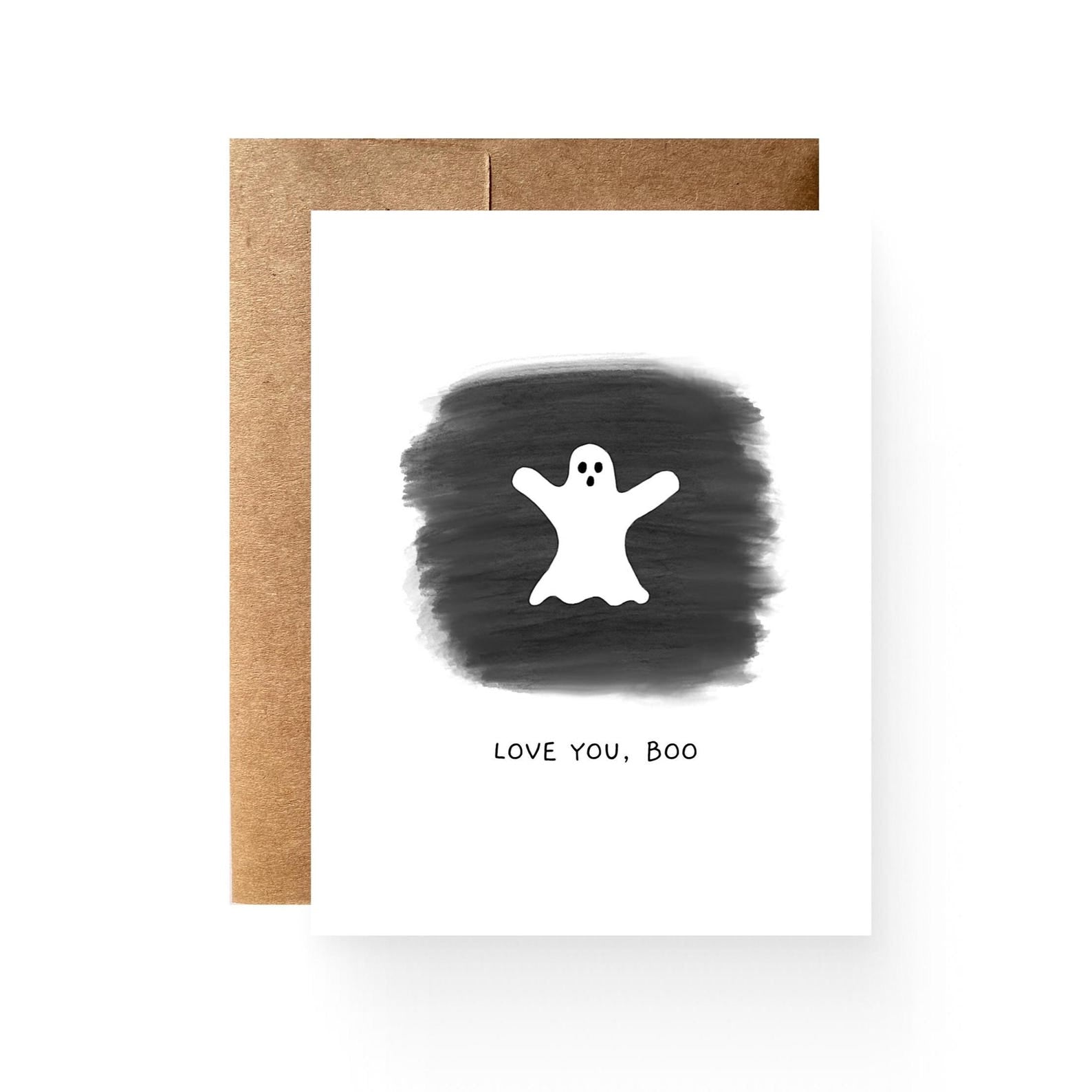 White card with black background and white ghost centered on the front with "LOVE YOU, BOO" below. Picture includes brown envelope sitting offset behind the card