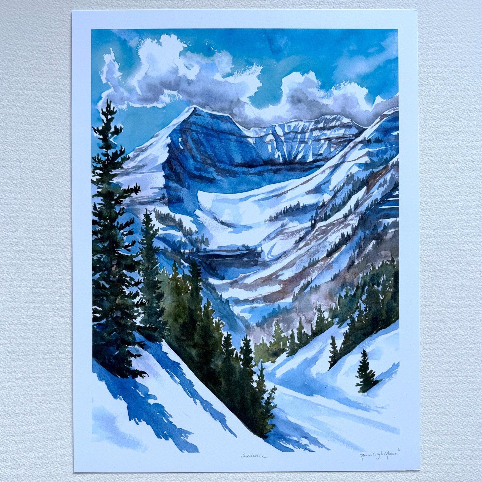 Unframed print against a white wall.