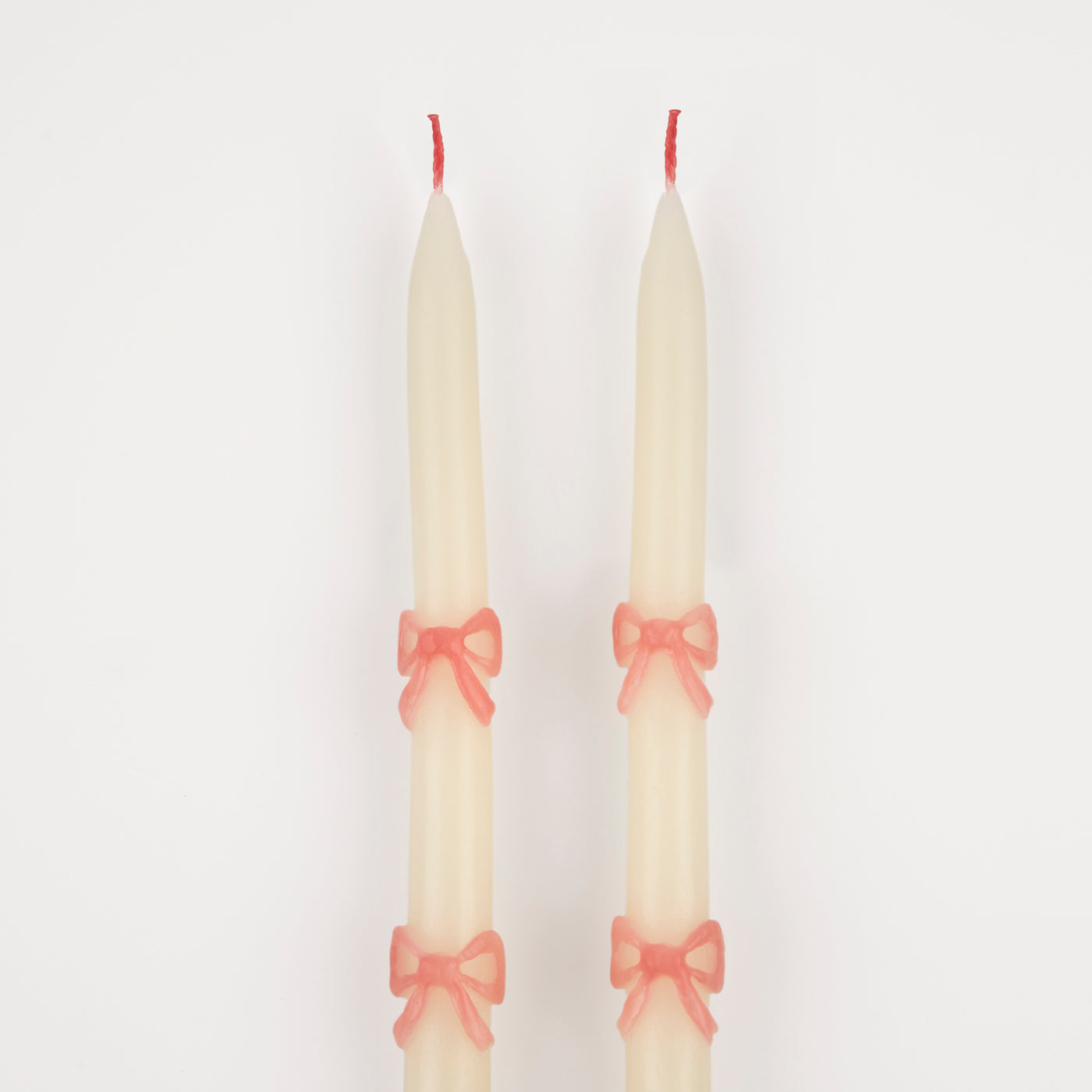 These tapered bow candles, have a special surprise detail - pink wicks! A wonderful hostess gift, or use to decorate the table or mantel at a party where pink will look just perfect, like a baby shower, bridal shower, princess or fairy party.