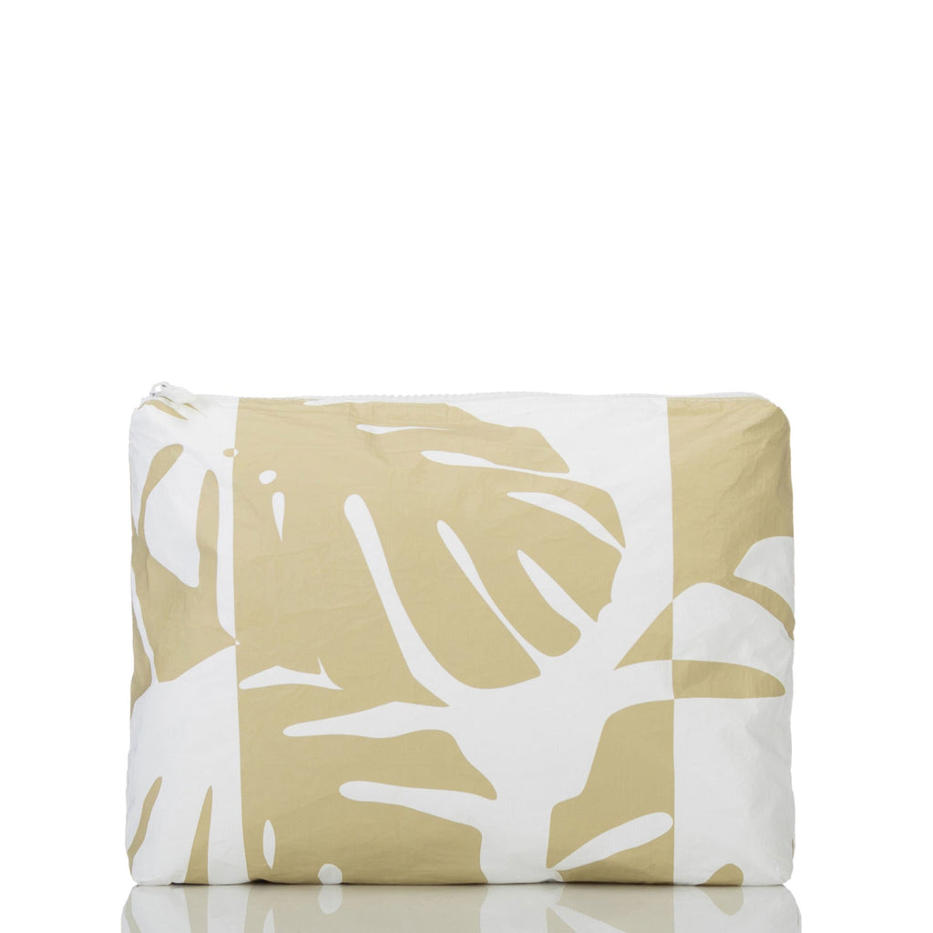 This Monstera Shade Sand multi-tasking Mid pouch is an excellent option for travel. Use it to stow accident-prone toiletries to eliminate leaks from happening inflight. You can also use it to pack tech and travel gear to keep your carry-ons organized and items like chargers and power cords within reach. Packing for a beach day? Toss in sunscreen, sunnies, pareo, book, a comb, and your coverup inside.
