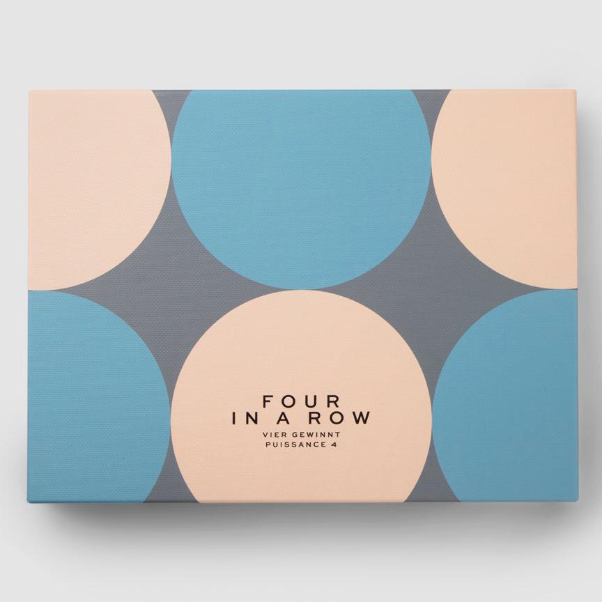 Experience our Play - Four in a Row set, a stylish twist on the classic game, featuring a sober palette and distinct graphics. It is made entirely of lacquered wood, including 42 playing discs (21 of each color), featuring a durable construction that conveniently folds into a compact size.
