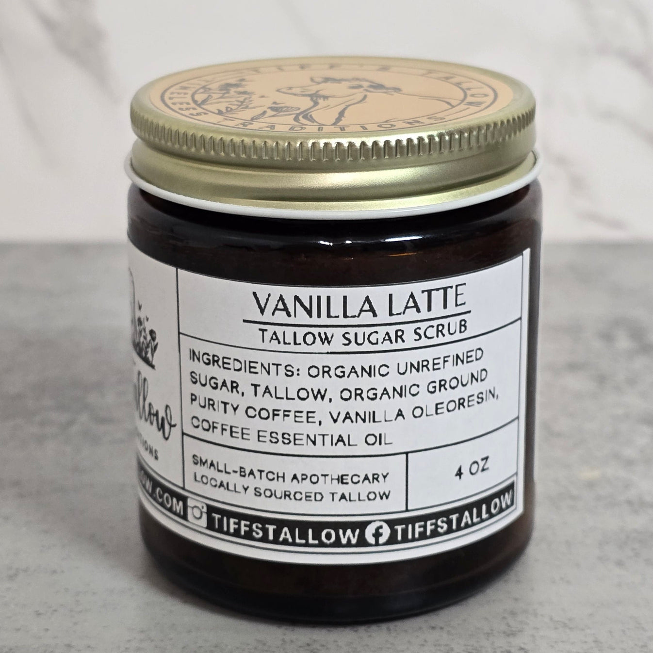4oz Vanilla Latte Sugar Scrub pictured against white marble.