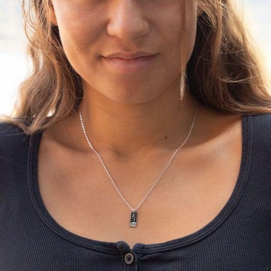 Solid Sterling Silver pendant. Polished finish on the front. Satin finish on the back. Solid Sterling Silver chain.
