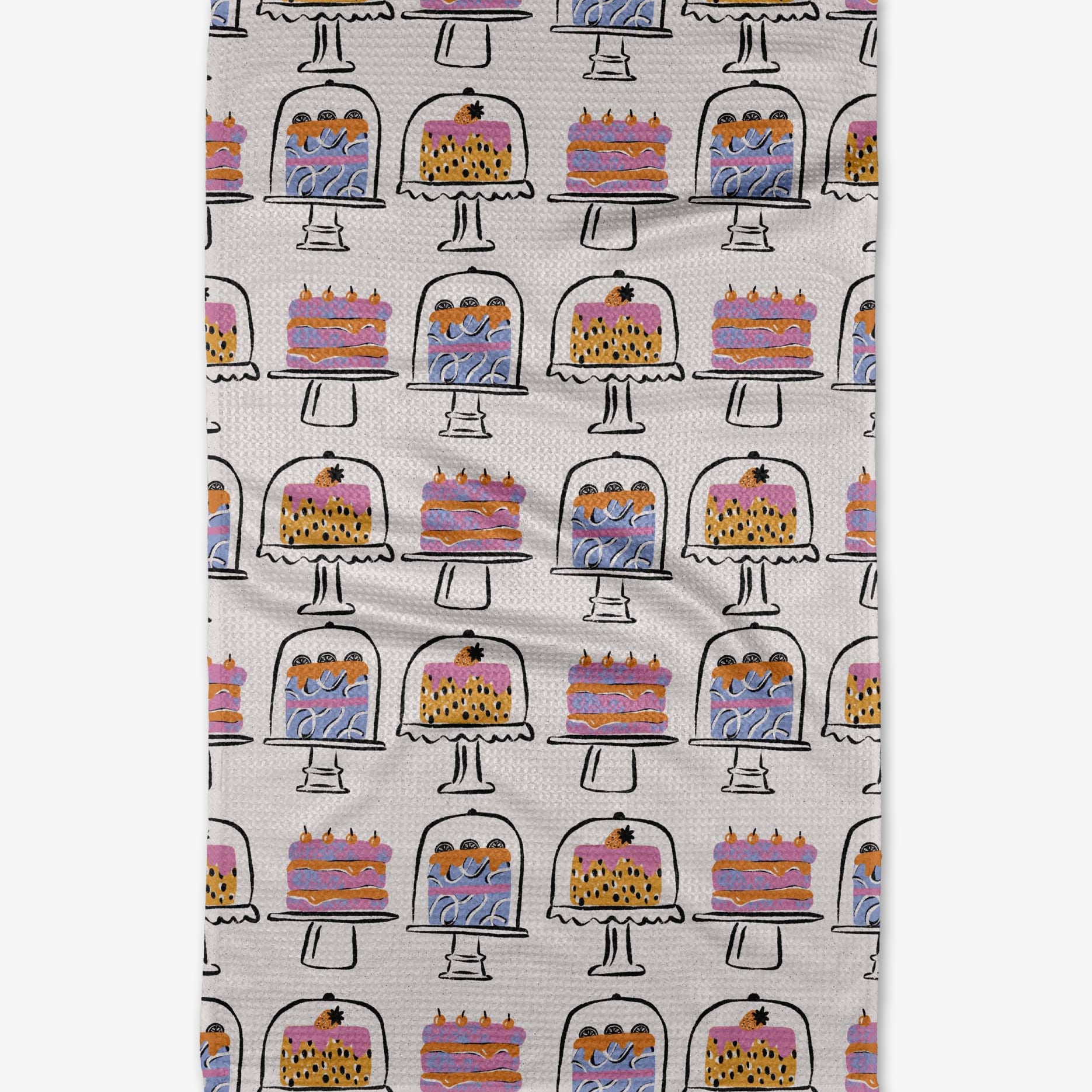 Tea towel with cake pattern on a white background