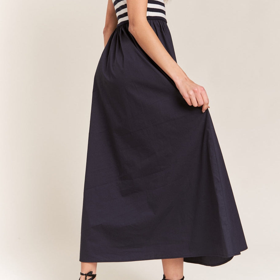 Get ready to strut your stuff in this Navy Striped Sleeveless Mock-Neck Maxi Dress. With its bold stripes and stylish mock-neck design, you'll be turning heads wherever you go. Perfect for a sunny day out or a night on the town. Express your unique style with this fun and chic dress!
Mock neckline, Sleeveless bodice, Fitted stripe top, Loose fit bottom, Maxi/ankle length dress, Self: 50% Viscose, 28%Polyester, 22% Nylon, Contrast: 100% Cotton