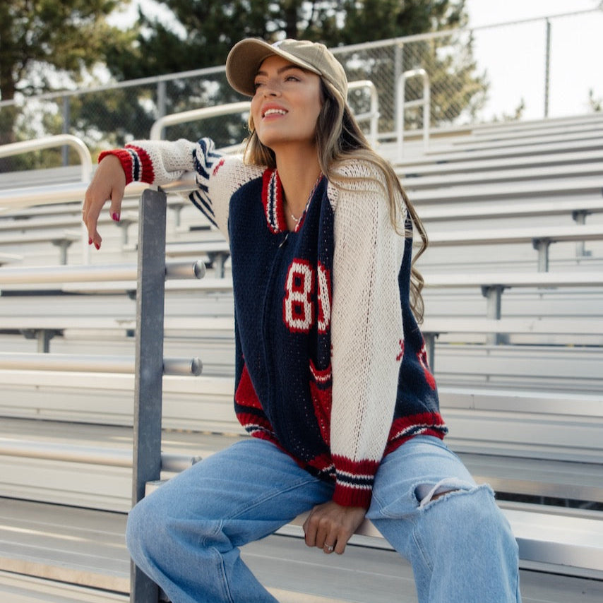 This sporty retro cardigan features a zip front + a letterman design. Perfect for those of us going back to school this year! A chunky knit and oversized fit give this cardi a cool girl look that you'll love this fall!
