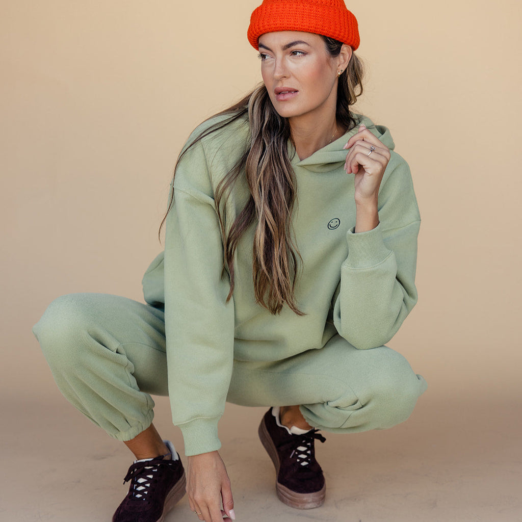 We got nothing but smiles here at ROOLEE :) These soft, french terry sweatpants feature an embroidered smiley face graphic, elastic waistband, + working pockets. The fit on these is perfect for cozying up next to the Christmas tree or running around town getting your Christmas shopping done. 