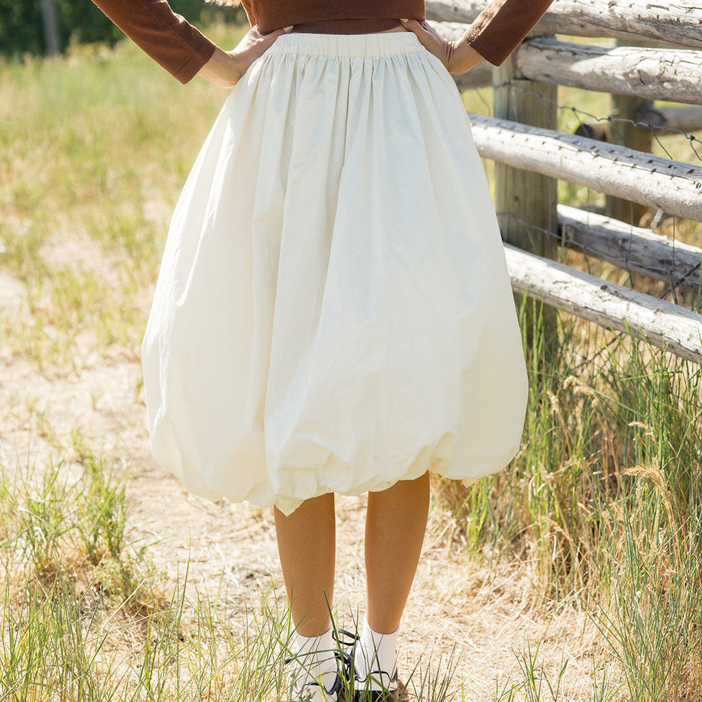 The Bella features an elastic waistband and a flattering length. This bubble skirt is so unique and fun we love it paired with something casual but you can dress it up to your heart's desire!