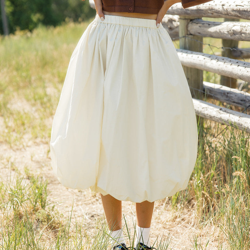 The Bella features an elastic waistband and a flattering length. This bubble skirt is so unique and fun we love it paired with something casual but you can dress it up to your heart's desire!