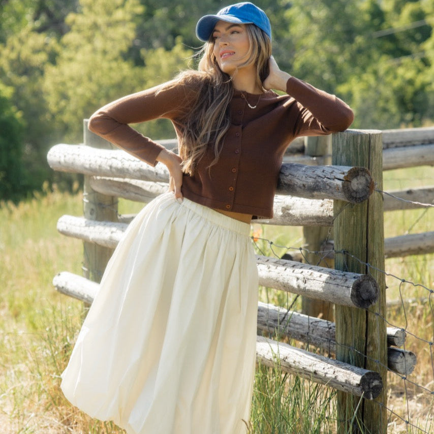 Who doesn't love a cardigan that can double as a top? The Down Bad Button Cardigan features a round neckline, functional buttons, and a cropped fit. We love it buttoned up for a fun take on a simple long-sleeve tee!