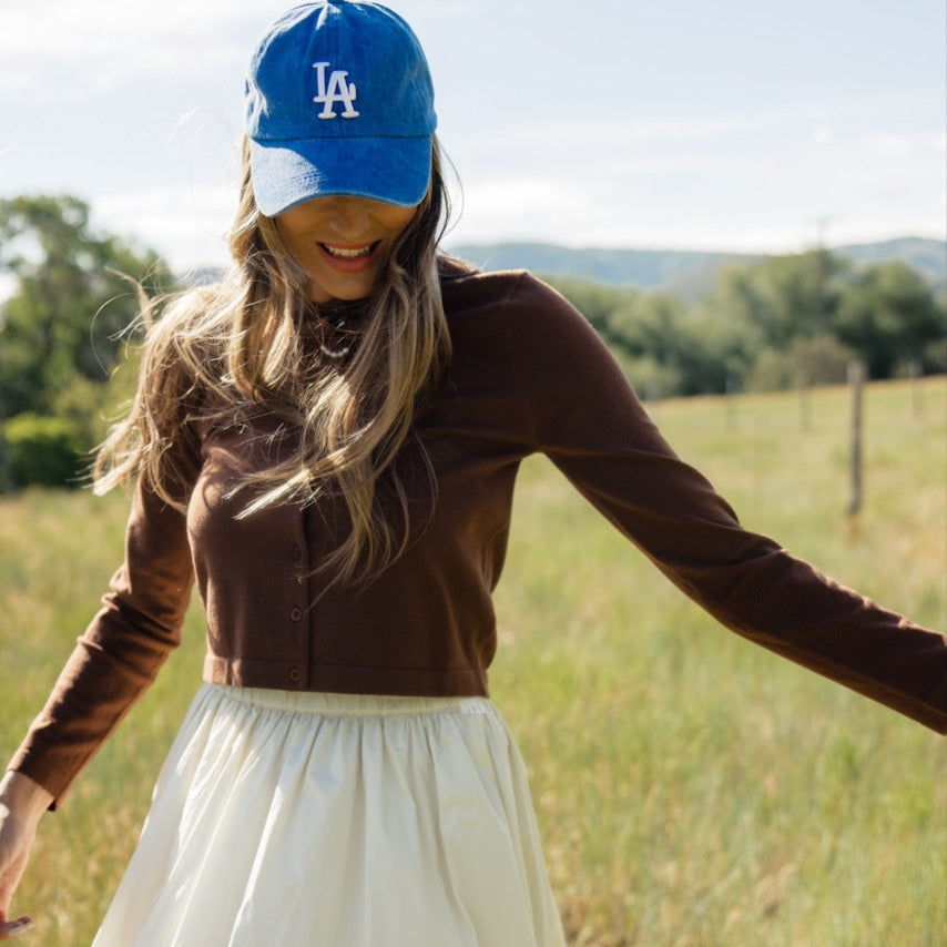 Who doesn't love a cardigan that can double as a top? The Down Bad Button Cardigan features a round neckline, functional buttons, and a cropped fit. We love it buttoned up for a fun take on a simple long-sleeve tee!